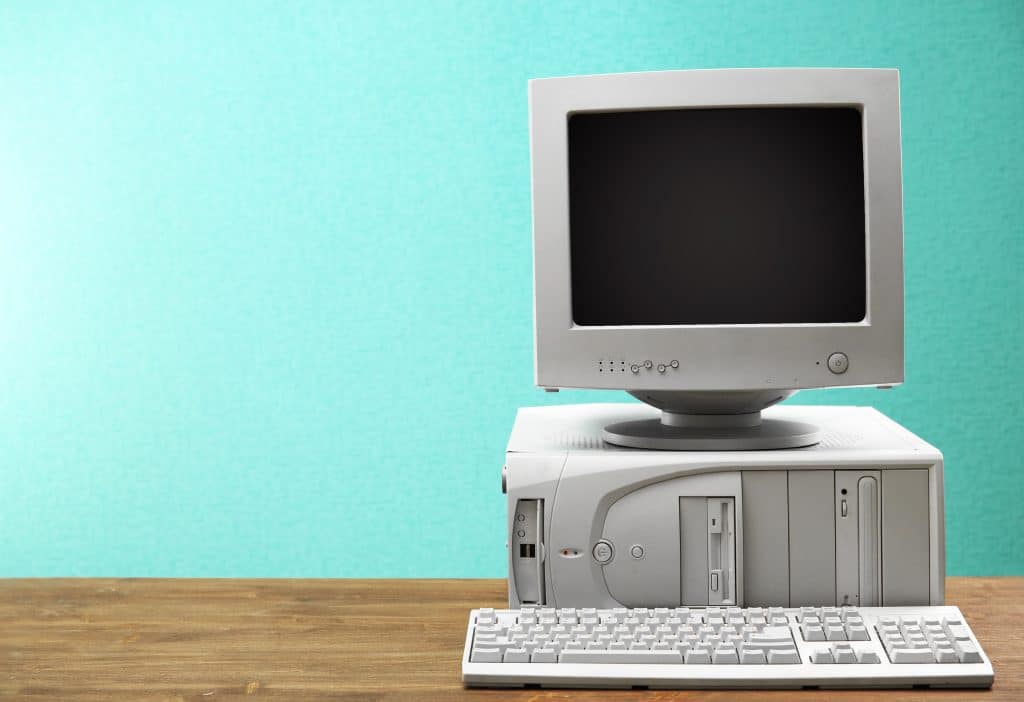 Obsolete computer set on light blue background - WeDoBack